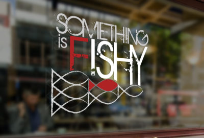 Something is Fishy window signage
